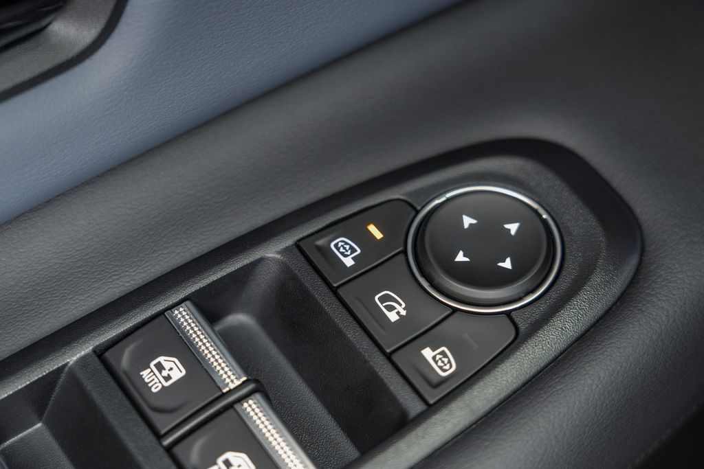 Content detailed shot of dials on the centre console area