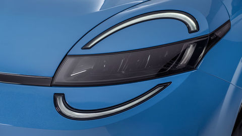 Thumb detailed shot of signature micra headlamps on blue body with led lights on