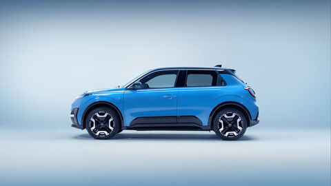 Thumb side profile view of all new nissan micra in gear blue body color and black roof