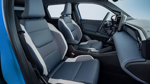 Thumb side view of micra front seats from passenger side door pov revealing leather materials  steering wheel and dashboard