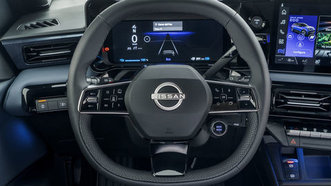 Thumb steering wheel detail showing nissan logo  combimeter and dials