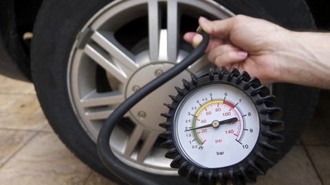 Thumb 65411 large checking tire pressure