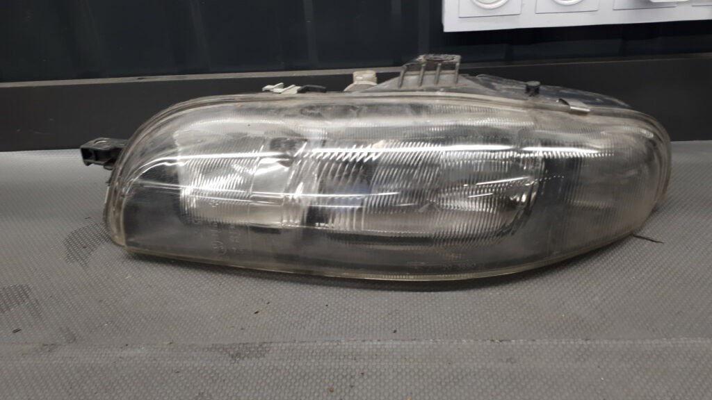 Reflektor lewy Fiat Bravo Brava TYC 98R