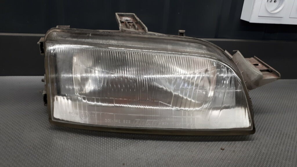 R142598-00 reflektor prawy FIAT PUNTO I 96r