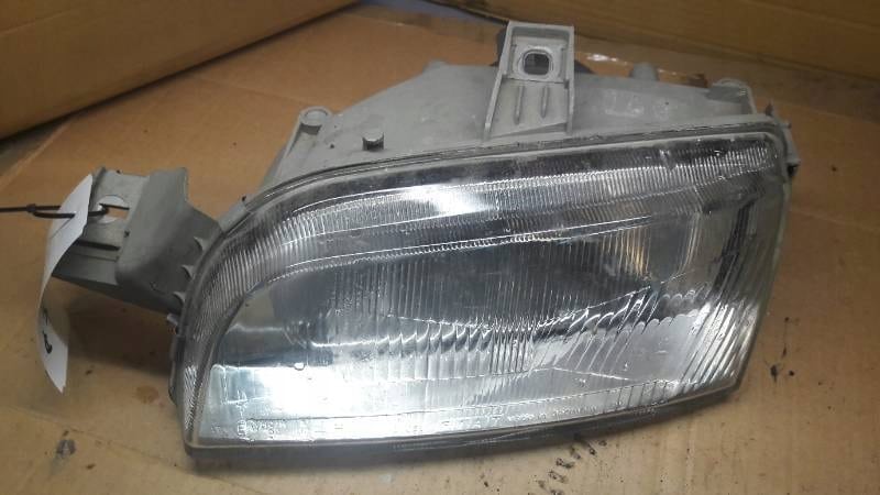 142597-00 reflektor lewy Fiat Punto I 176