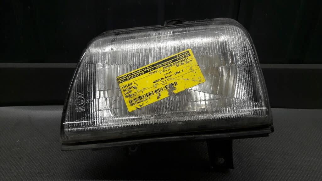 reflektor lewy  daihatsu Cuore II 88r