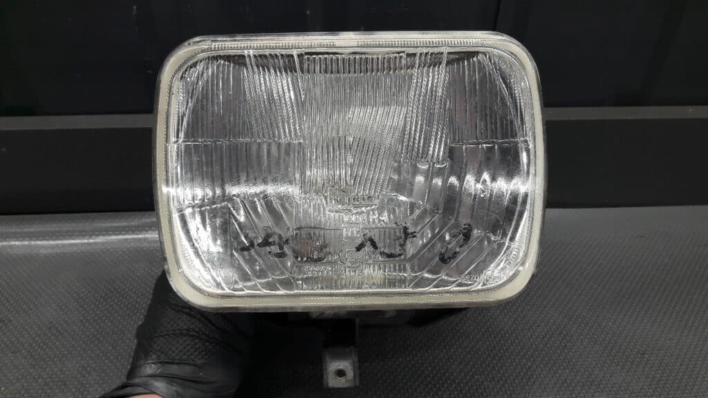 7R0188701 reflektor prawy  JEEP CHEROKEE 95r