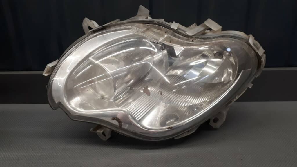 1305235496 Reflektor lewy Smart Fortwo I 450