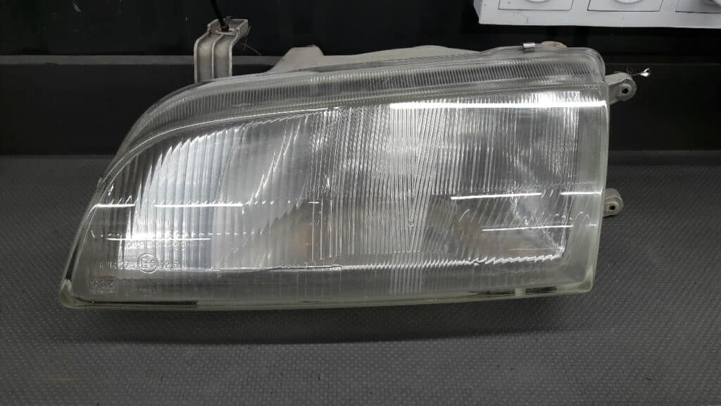 Reflektor lewy Suzuki Swift II Valeo