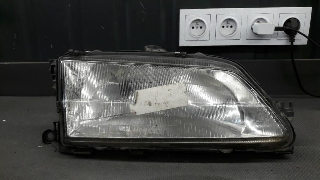 0291091 Reflektor lewy Peugeot 306 95r