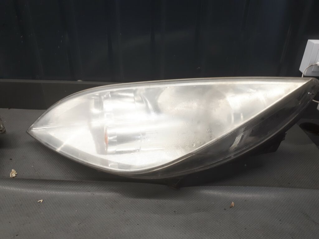 8301A283 reflektor lampa przód lewa colt VI