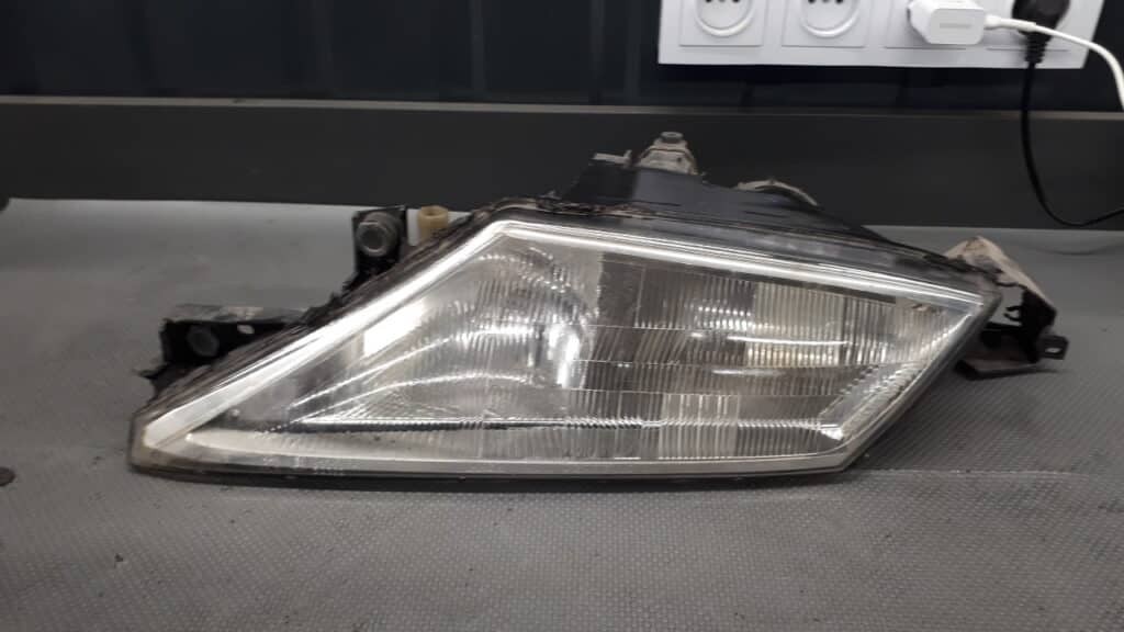 Reflektor lewy Lancia Ypsilon 96r