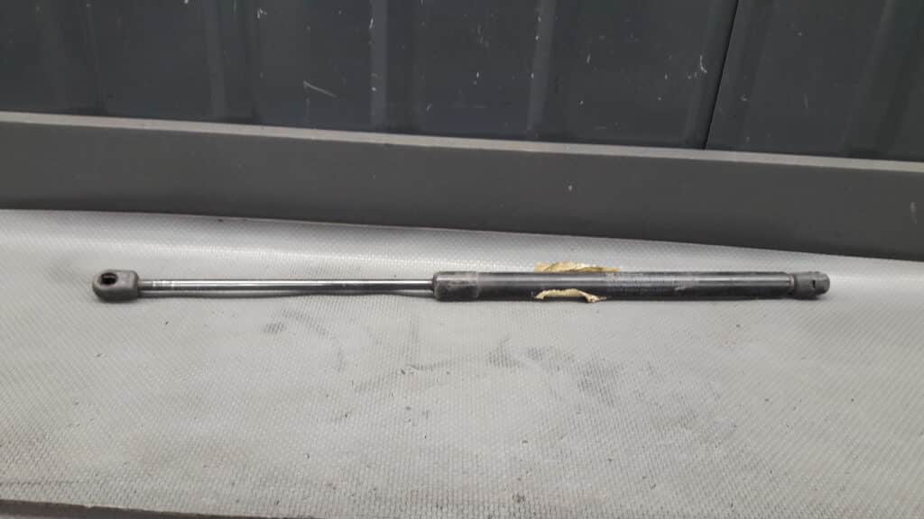 90450AX60A silownik klapy bagaznika Nissan MICRA K12