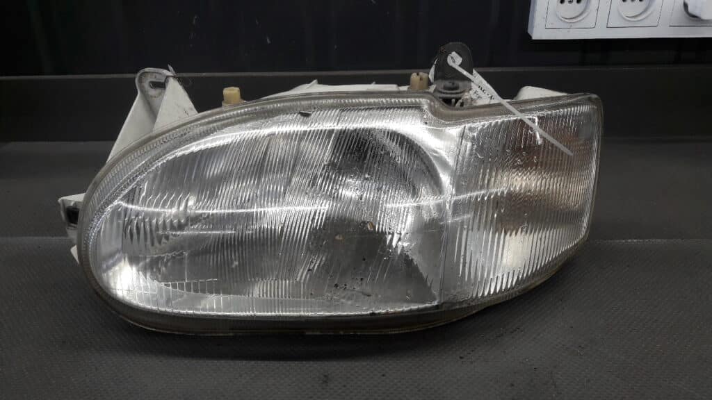 Reflektor lewy Ford Escort MK7 Valeo 96r