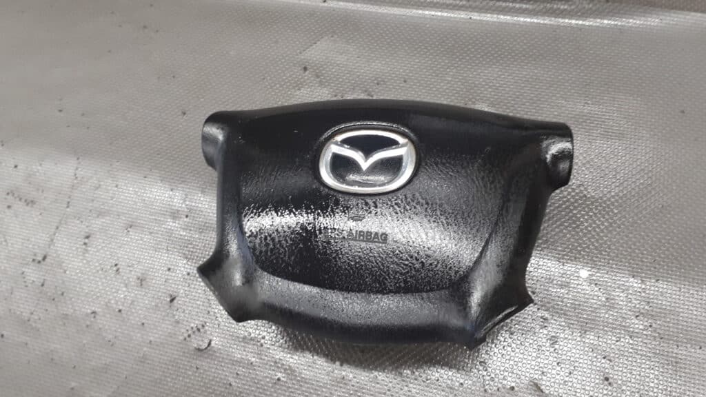 B25F57K00 airbag kierowcy mazda 323