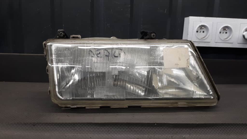 7R0143988 reflektor prawy lancia dedra carello