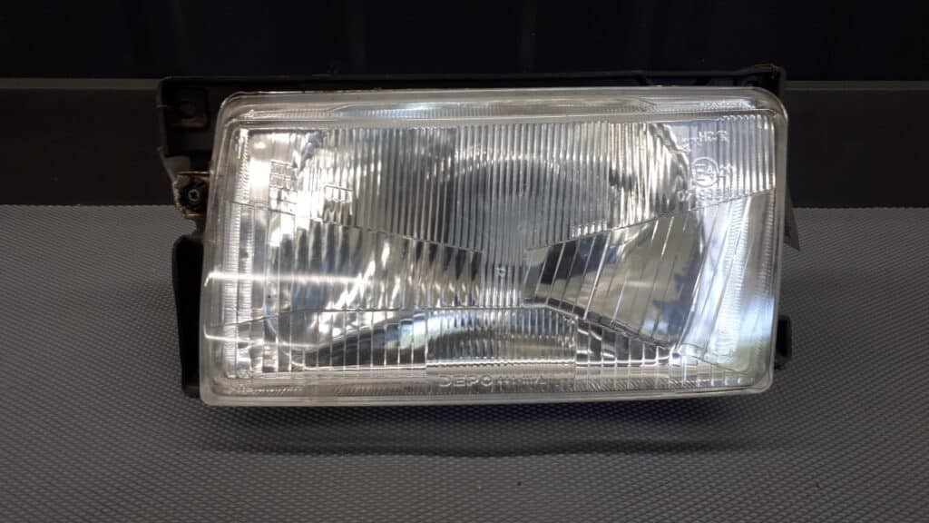 441-1117 reflektor  VW POLO II LEWY DEPO 91R