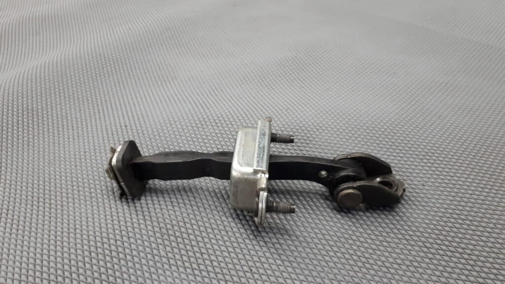5S6AA23500AB ogranicznik drzwi przod fiesta mk2