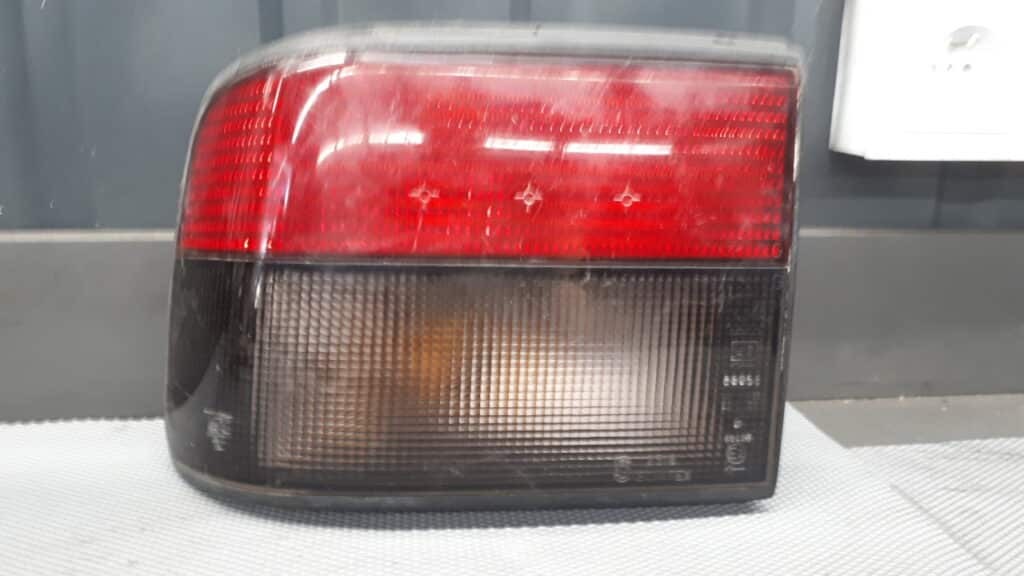 7700792974 lampa lewa renault 21 hb