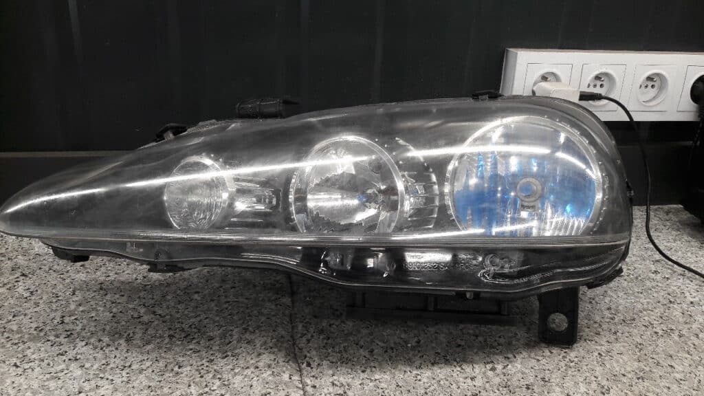 89101234SX reflektor lampa alfa romeo 147 lift lewa