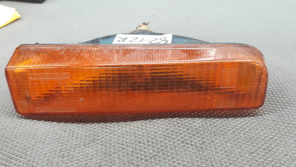 77FG13368CA kierunkowskaz lewy FORD FIESTA MK1 78r