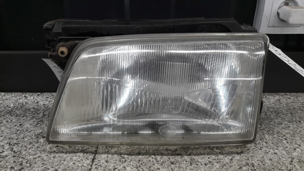 reflektor lewy opel kadett e hella 91r