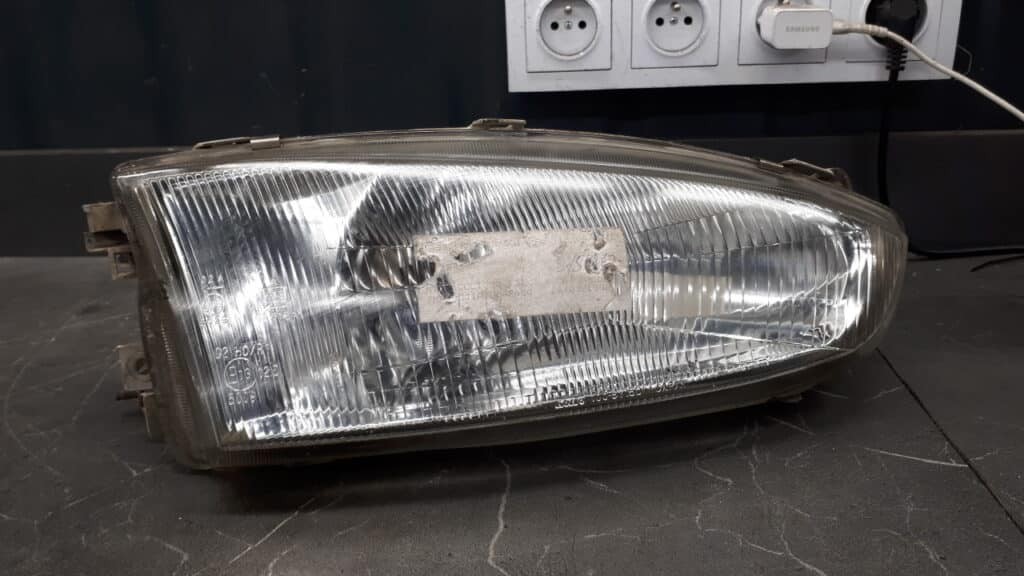 100-87150 reflektor prawy mitsubishi colt V 3d 96-04r