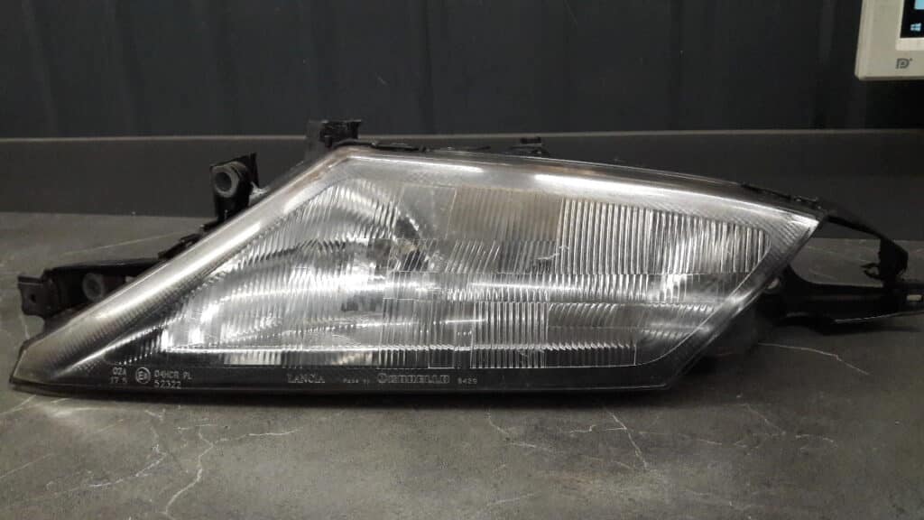37130748 reflektor lewy LANCIA YPSILON  96r