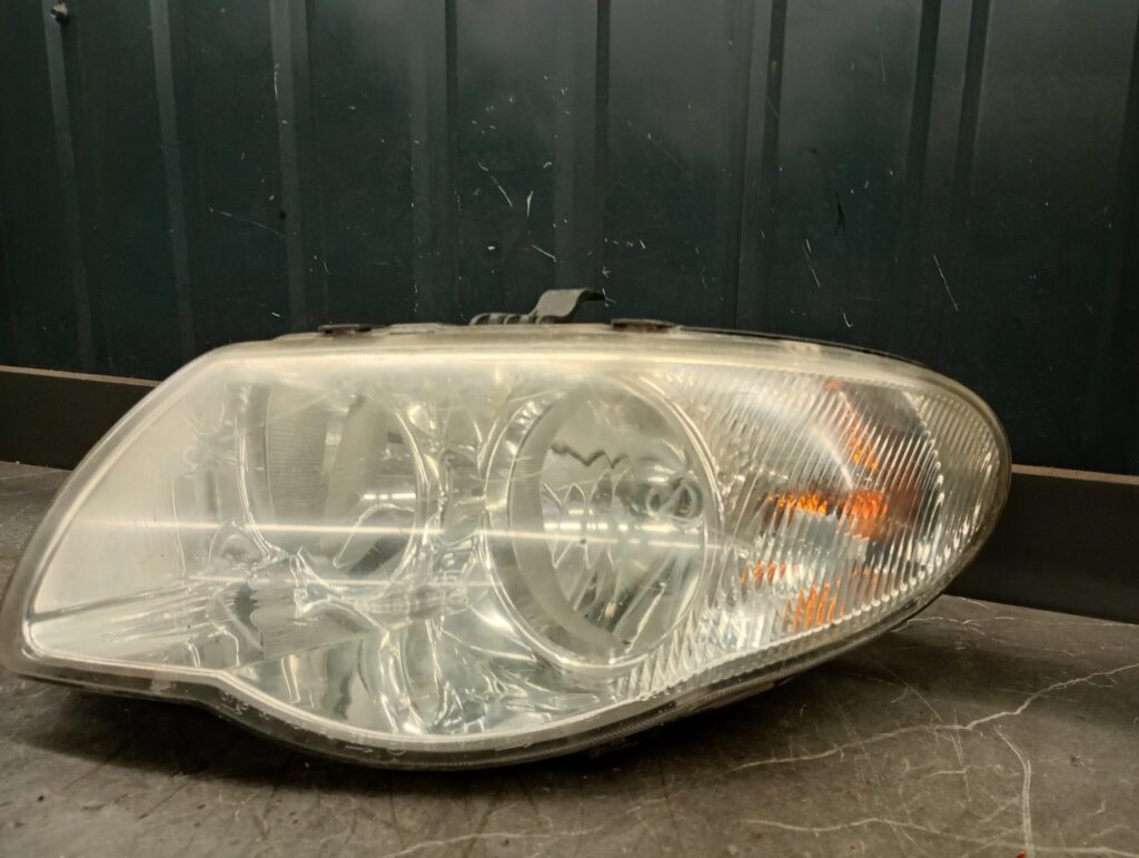 04857831AC reflektor lewy Chrysler Voyager IV lift