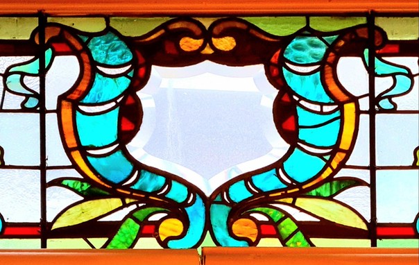 A decorative stained glass window in a Glasgow pub.