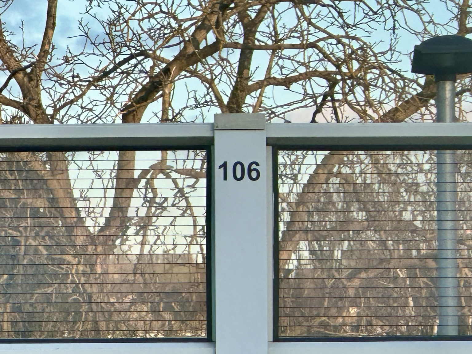 Post at a train station in Germany with the number 106