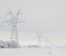 Transmission_towers_and_lines_with_snow_in_East_Texas