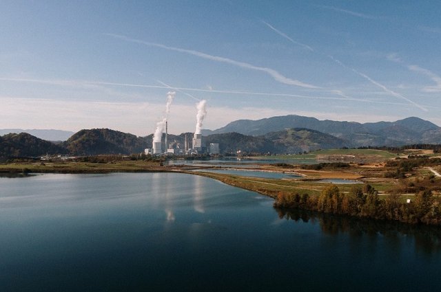 aerial-shot-landscape-surrounded-by-mountains-lakes-with-industrial-disaster