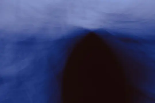 An abstract image featuring blurred shapes in shades of blue and dark brown, with a soft, ethereal quality.