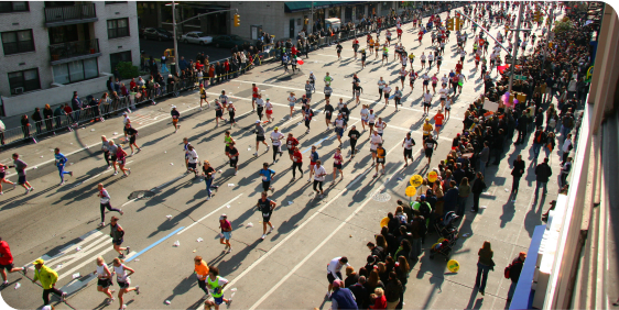 People in costumes parade through the city