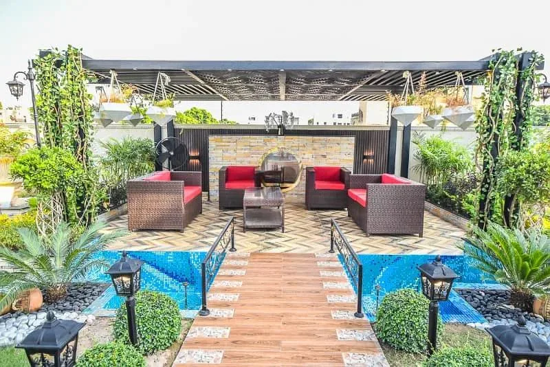 Spacious 1 Kanal Lawn & 1 Kanal Built Home Near Dolmen Mall and Large Park