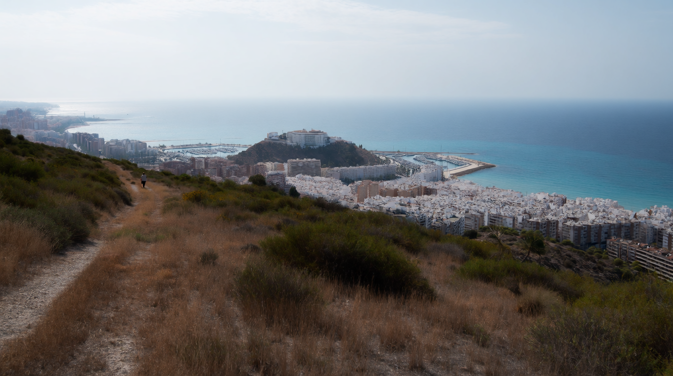 Altea's whitewashed old town seen from a hillside path above the Alicante coast
