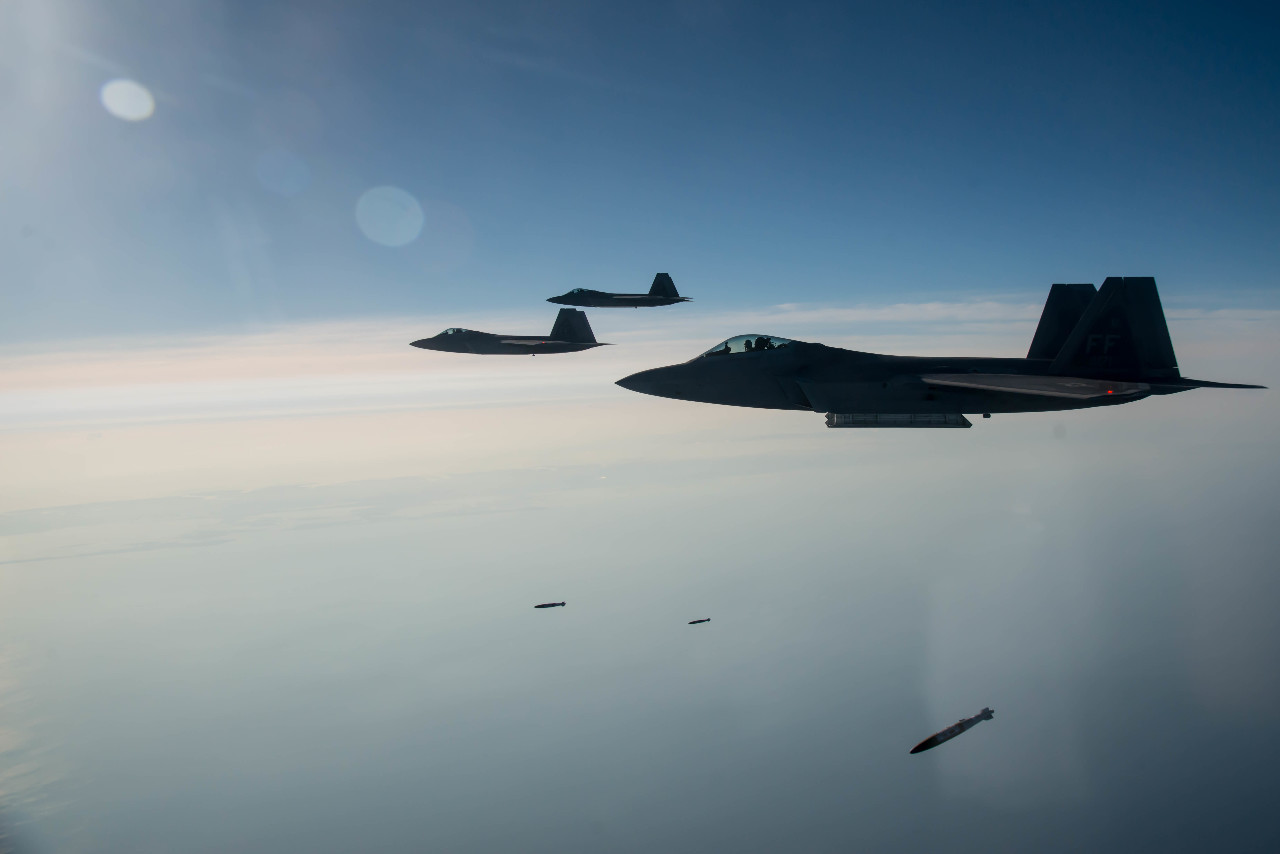 Photo: F-22s drop JDAMs