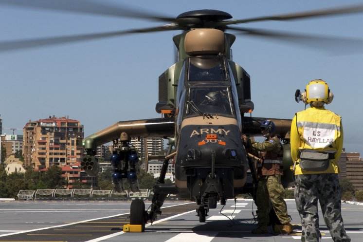 Australian Army Tigers in flight trials on HMAS Canberra