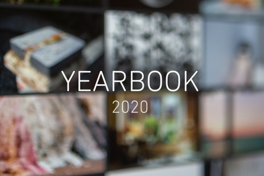 Image of a screen showing an online photography exhibition, very soft focus, with text in the middle reading 'YEARBOOK 2020'