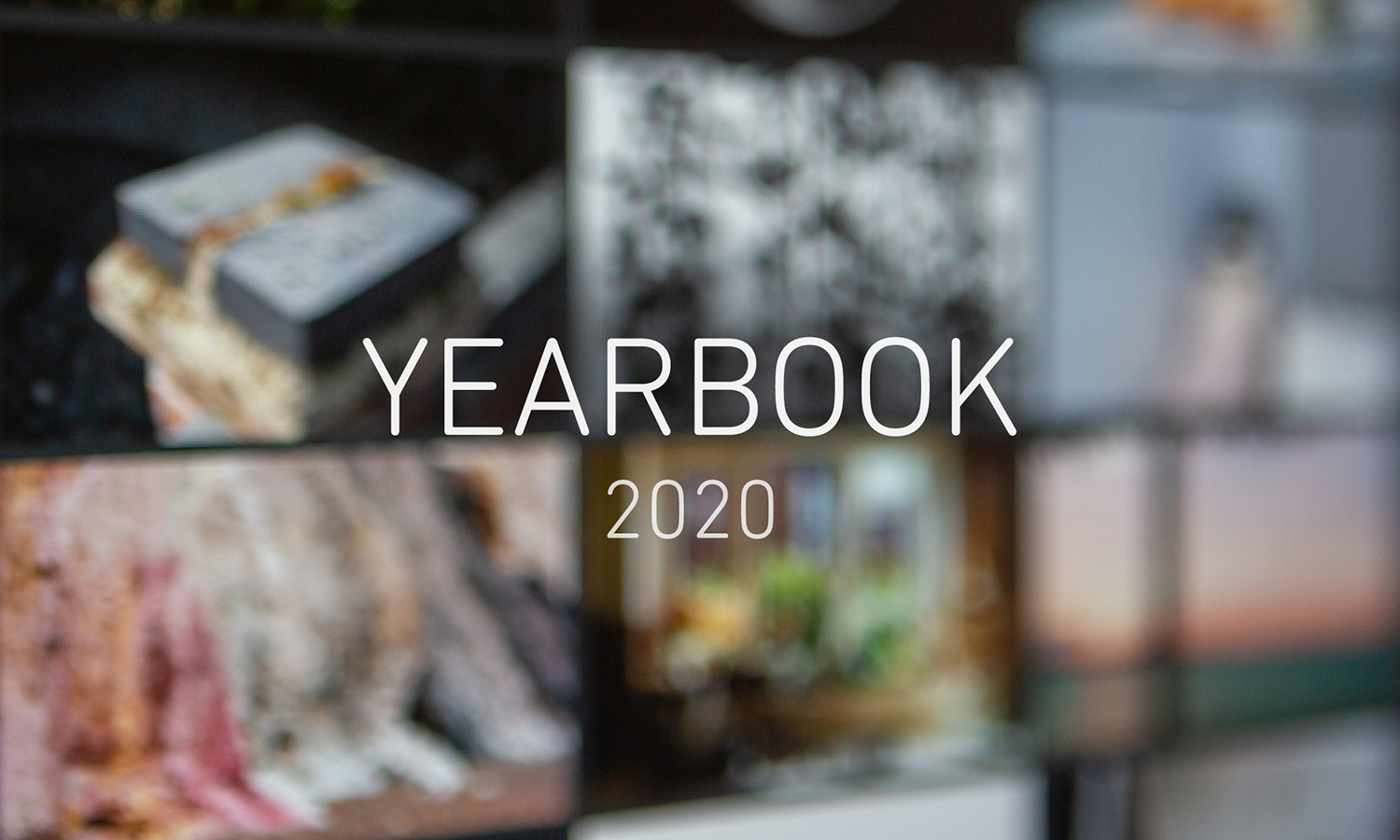 Image of a screen showing an online photography exhibition, very soft focus, with text in the middle reading 'YEARBOOK 2020'