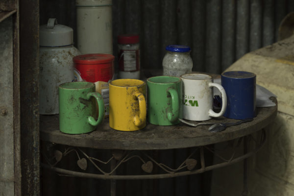 Tea mugs lined up on table