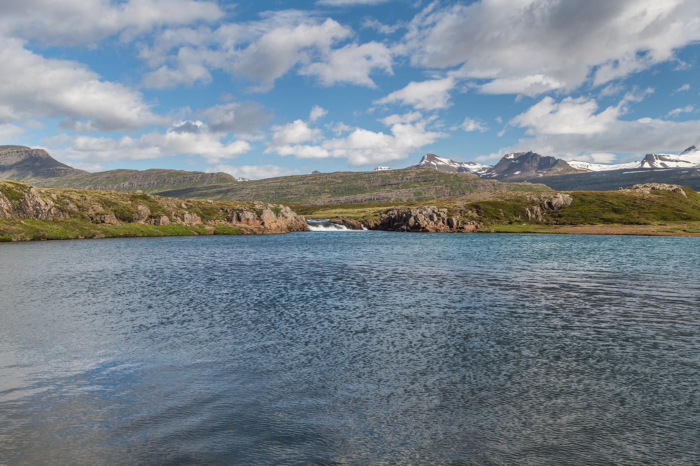 Wide Breiðdalsá river view around Beljandi with mountains across the valley.