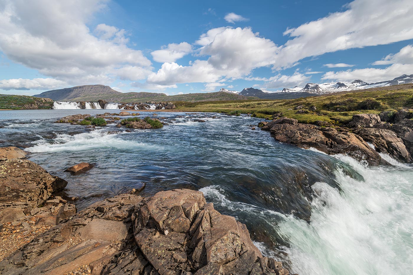 Pool and low cascade at Beljandi Waterfall in East Iceland.