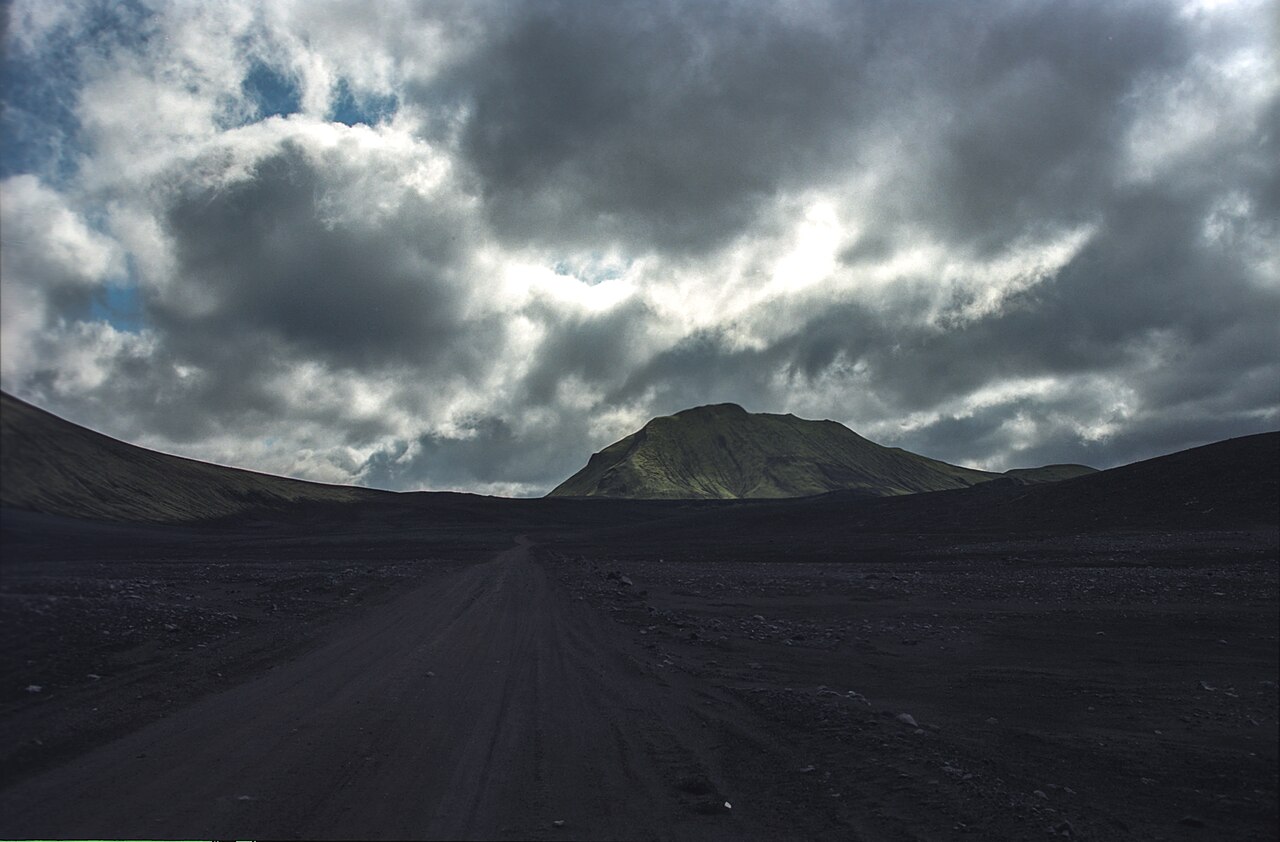 Fjallabaksleid nyrdri F208 road crossing dark highland terrain near Hnausapollur.