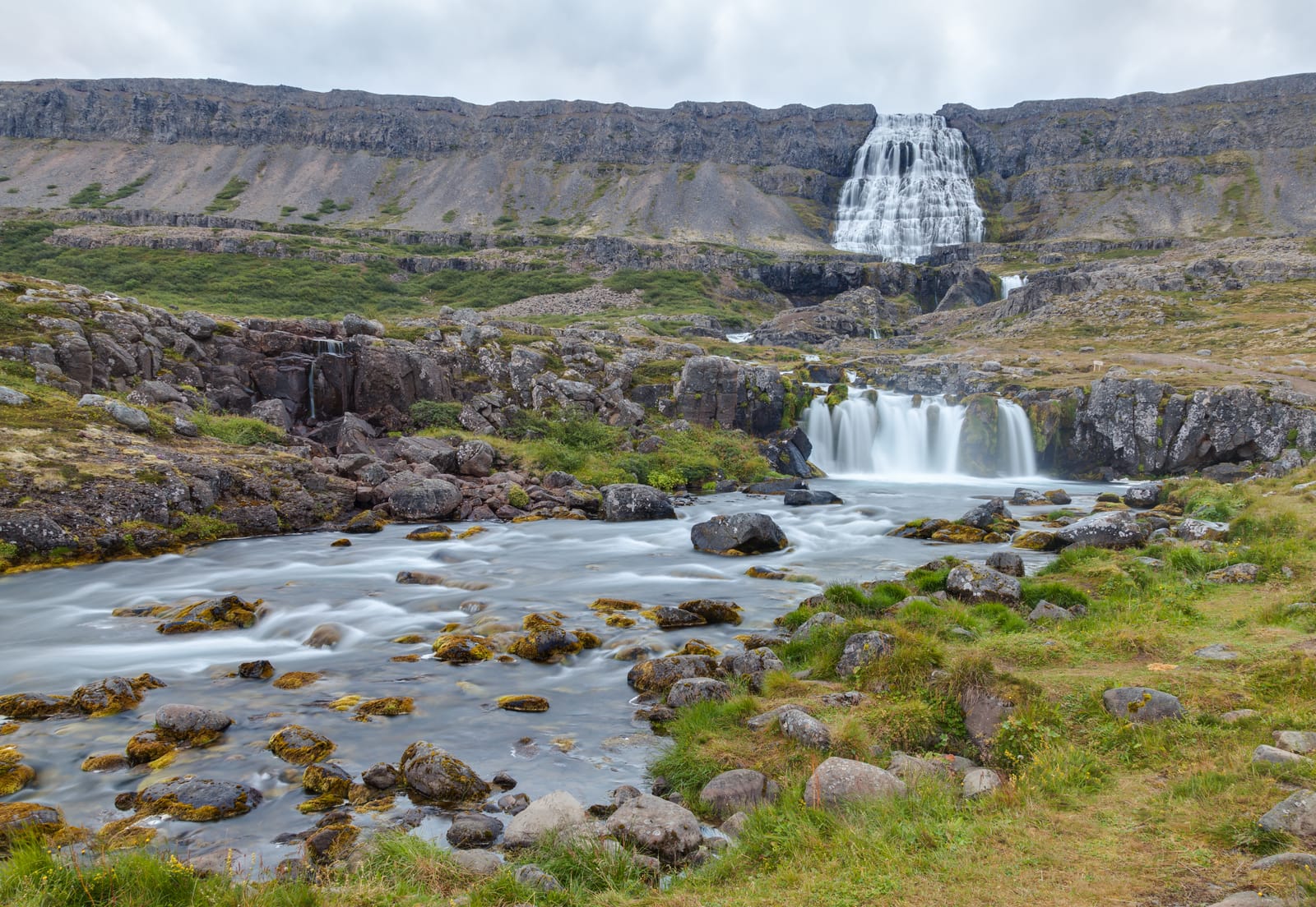 Dynjandi waterfall above lower cascades and the walking approach in the Westfjords.