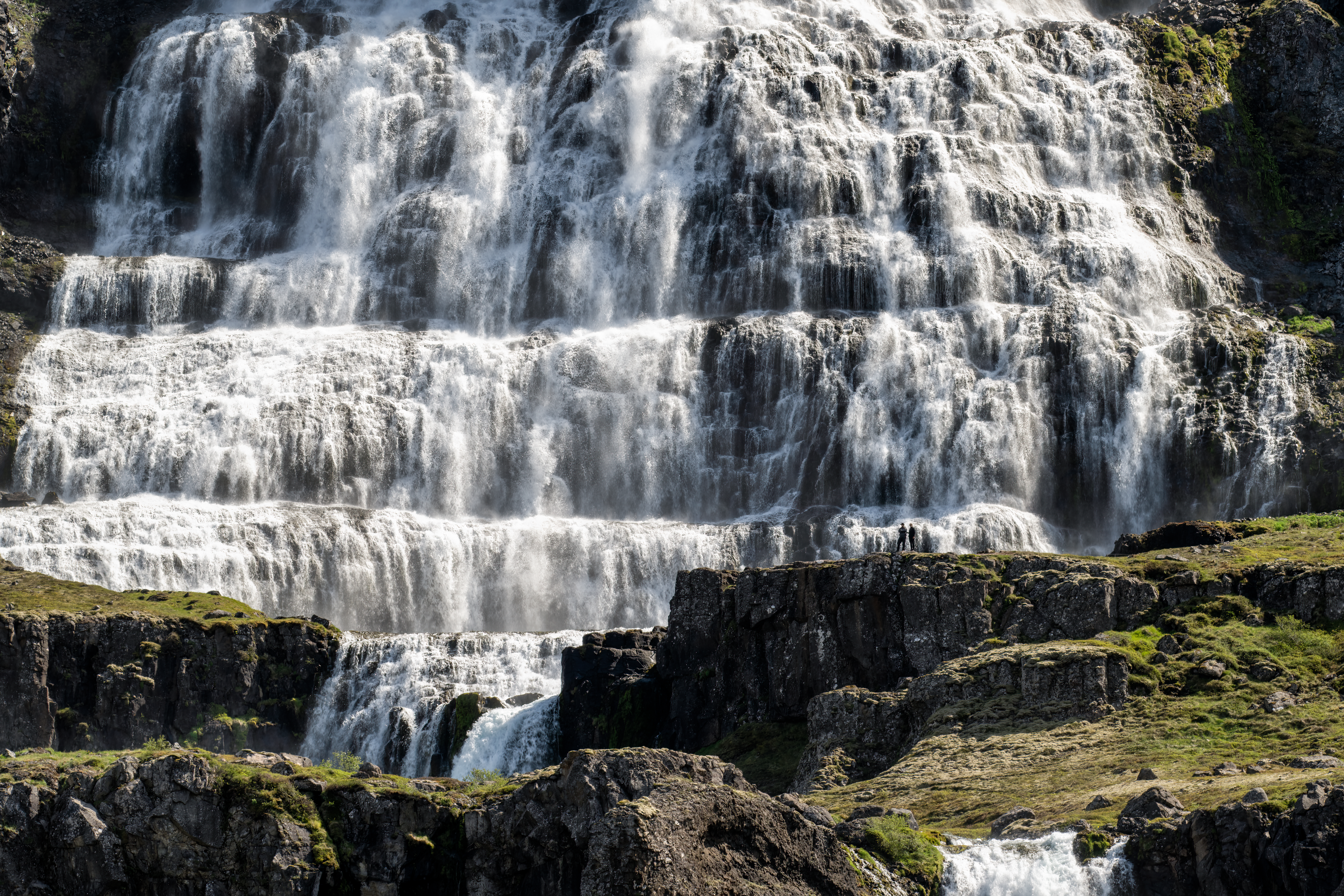Close view of white water spreading across ledged rock at Dynjandi.