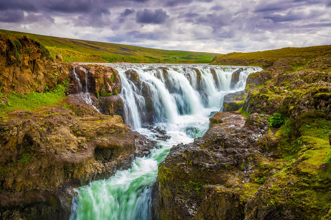 Kolugljúfur canyon and waterfalls in North Iceland, a nearby anchor for a slower Hóp Lake route.