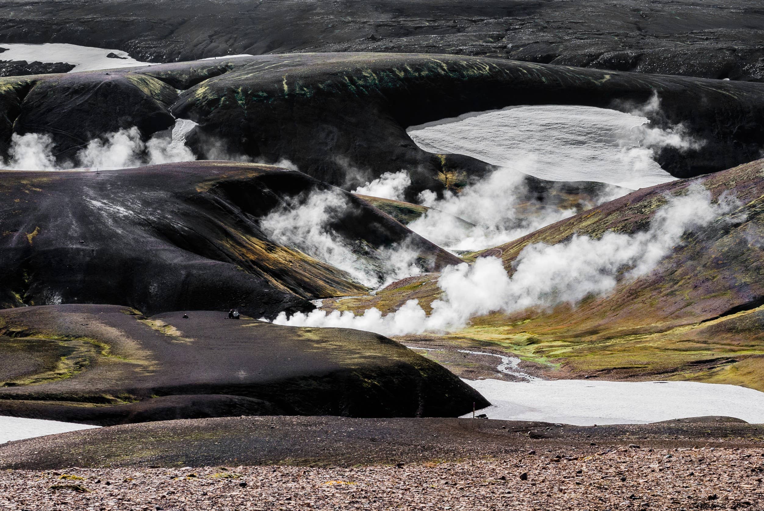 Geothermal steam rising along the Landmannalaugar to Hrafntinnusker hiking trail.