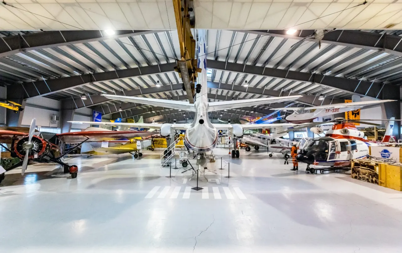Wide view of aircraft displayed across the Icelandic Aviation Museum hangar.